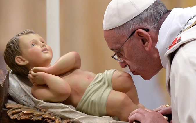 Pope Francis kissing Baby Jesus.